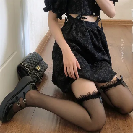 Imagen de producto de: Pantys Negras traslúcidas con moño negro
